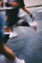 Person running on a road with motion blur effect